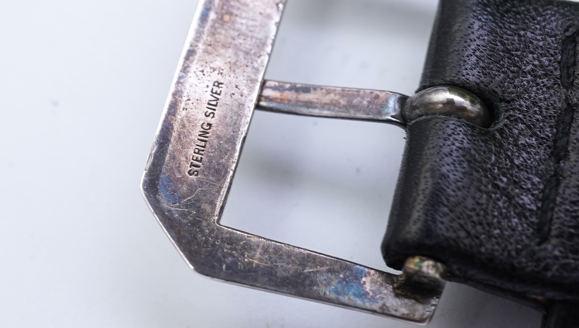 A lady's 18k white gold International Watch Company manual wind wrist watch, on a later associated leather strap